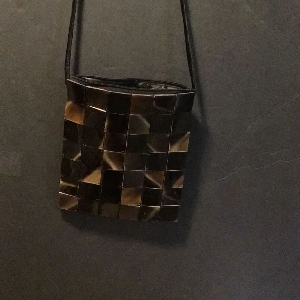 Vintage Abalone shell purse by Shiraleah has snags on back front is perfect